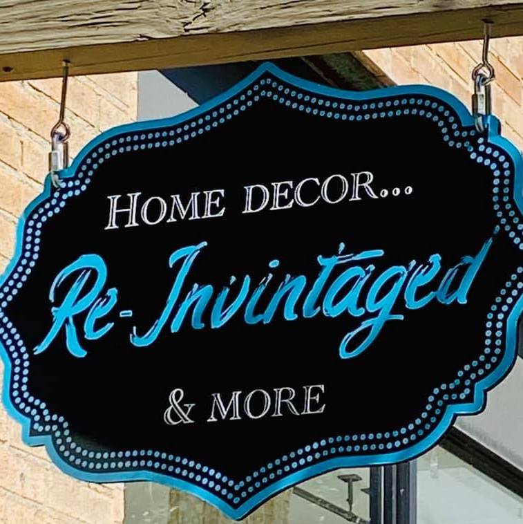 Sign with text: Re-Invintaged Home Decor & More