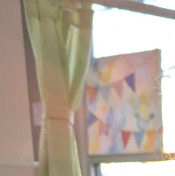 window with curtain and banner