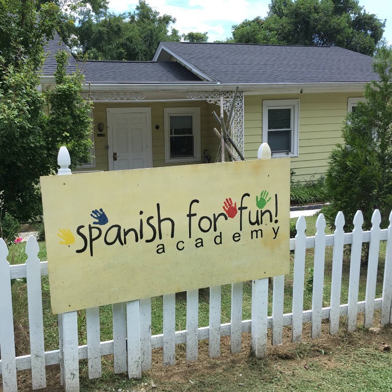 Fence with sign and front door of Spanish for Fun Academy childcare